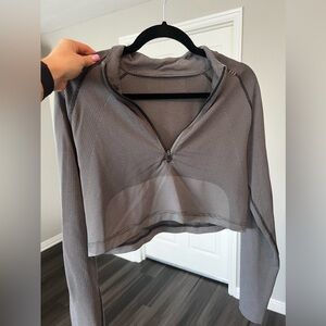 Lululemon cropped long sleeve- Men’s size S/ warn women’s size medium